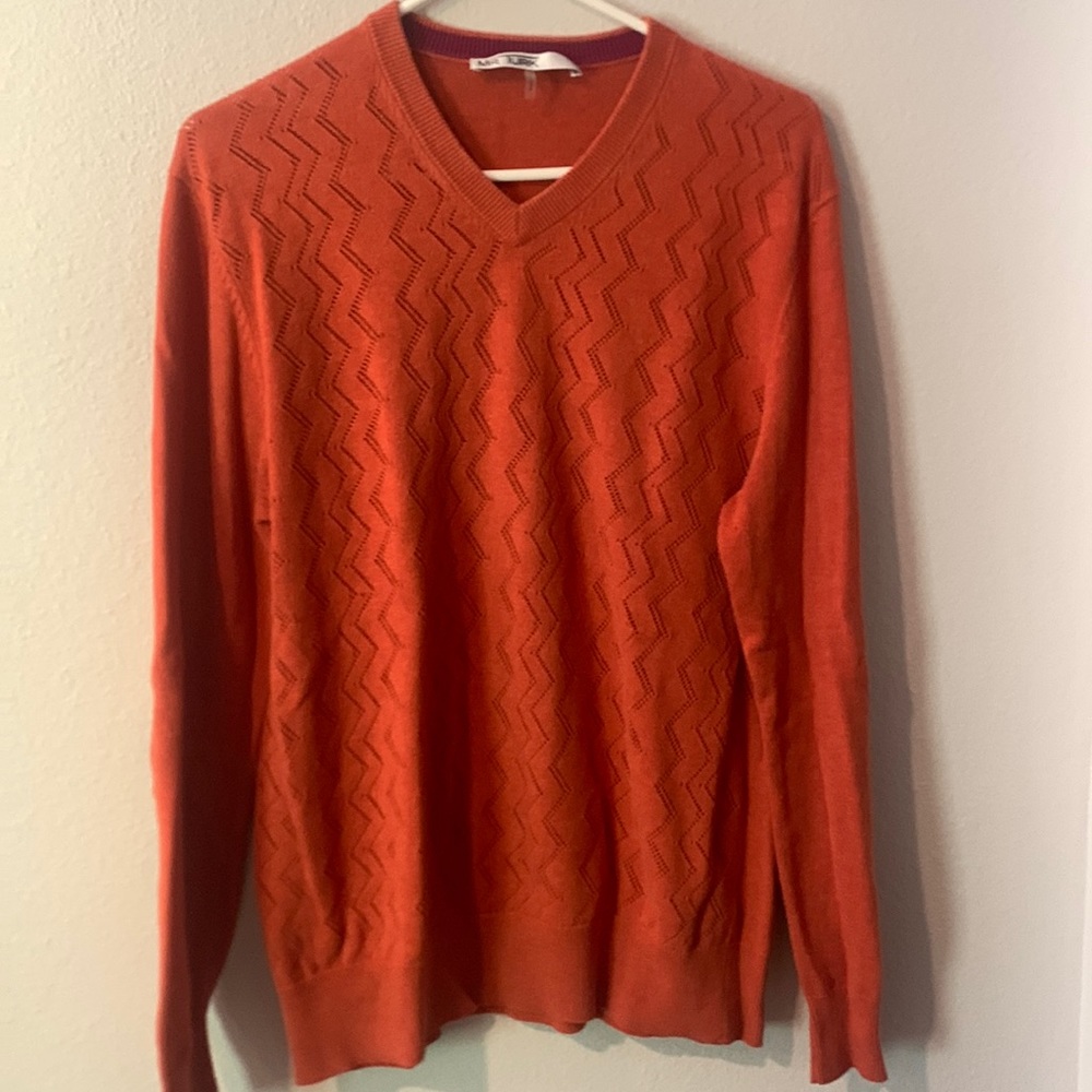 Mr. Turk. Orange sweater.